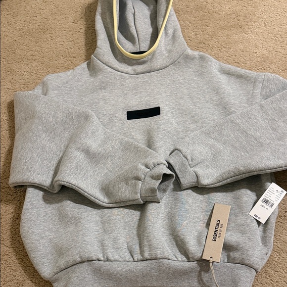 NEW ESSENTIALS Gray Pullover Hoodie with Black Logo Patch